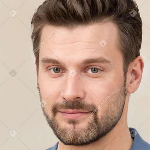 Joyful white adult male with short  brown hair and brown eyes