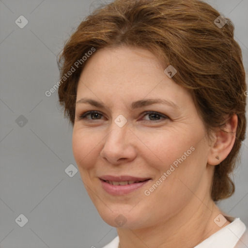 Joyful white adult female with short  brown hair and brown eyes