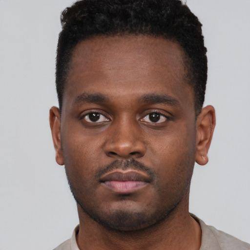 Neutral black young-adult male with short  brown hair and brown eyes