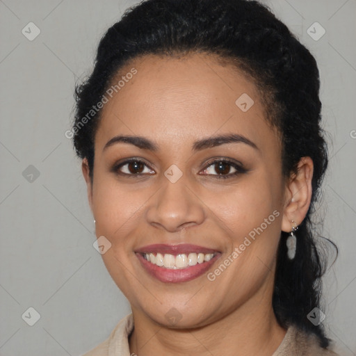 Joyful latino young-adult female with long  brown hair and brown eyes