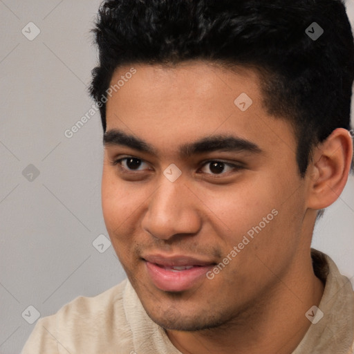 Joyful white young-adult male with short  black hair and brown eyes