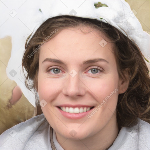 Joyful white young-adult female with medium  brown hair and blue eyes