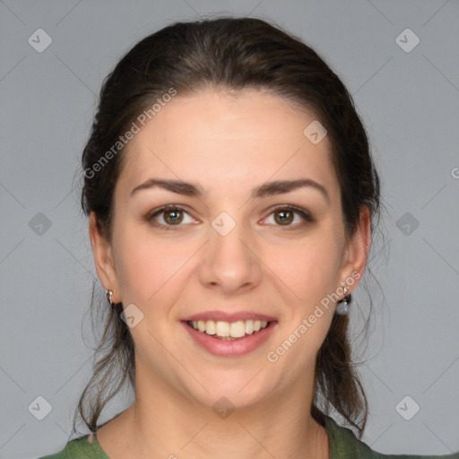 Joyful white young-adult female with medium  brown hair and green eyes