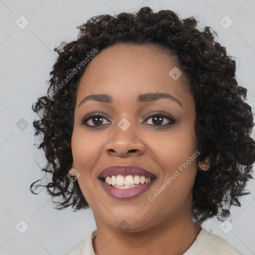 Joyful black young-adult female with medium  black hair and brown eyes