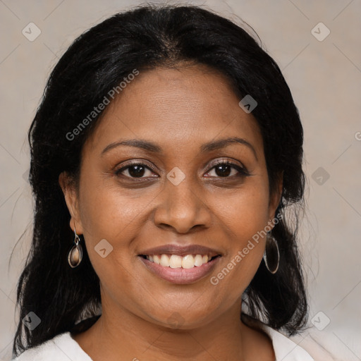 Joyful black adult female with medium  brown hair and brown eyes