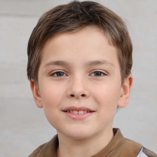 Joyful white child male with short  brown hair and grey eyes