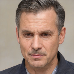 Neutral white middle-aged male with short  brown hair and brown eyes