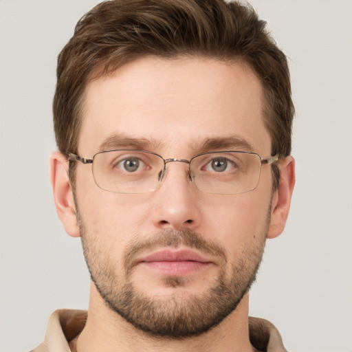 Joyful white young-adult male with short  brown hair and grey eyes