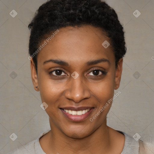 Joyful black young-adult female with short  black hair and brown eyes