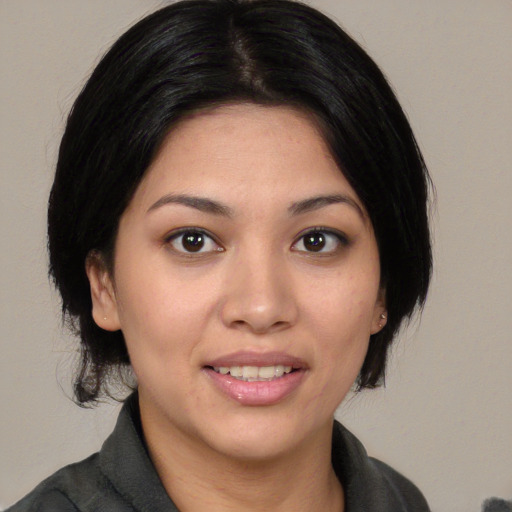 Joyful white young-adult female with medium  black hair and brown eyes