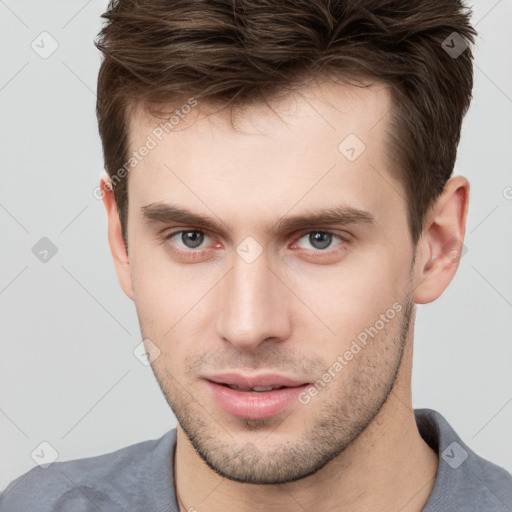 Neutral white young-adult male with short  brown hair and brown eyes