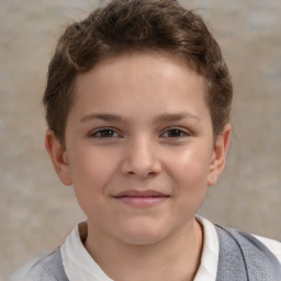 Joyful white child male with short  brown hair and brown eyes