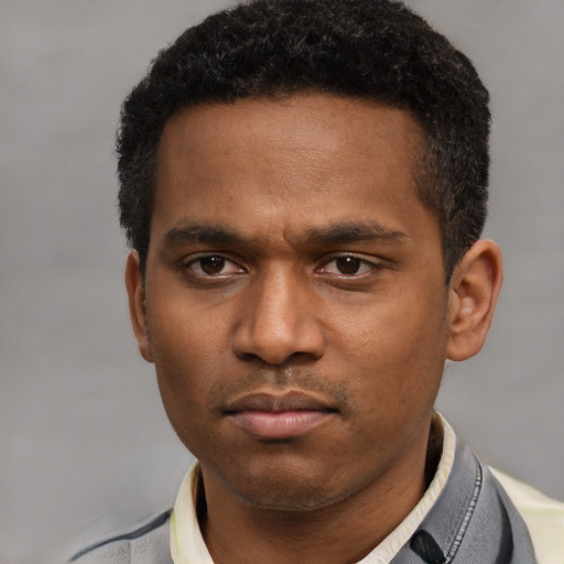 Neutral latino young-adult male with short  black hair and brown eyes