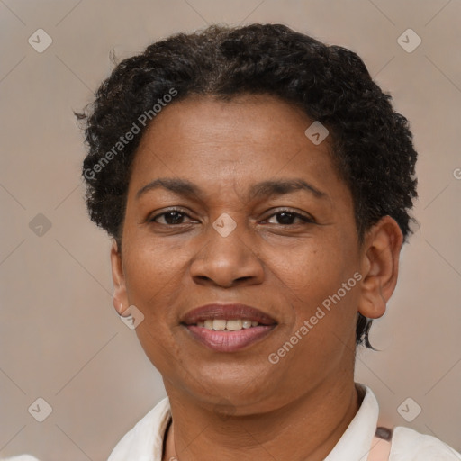 Joyful latino adult female with short  brown hair and brown eyes