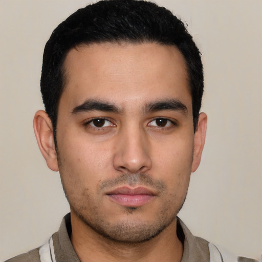 Neutral latino young-adult male with short  black hair and brown eyes
