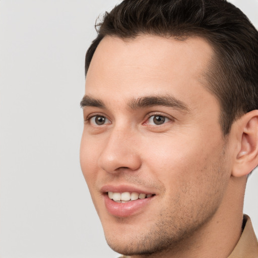 Joyful white young-adult male with short  brown hair and brown eyes