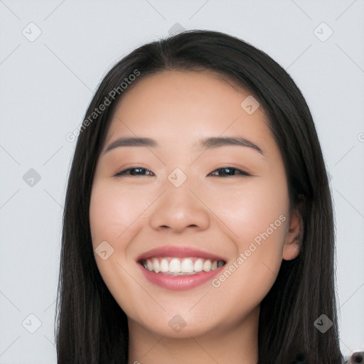 Joyful white young-adult female with long  black hair and brown eyes