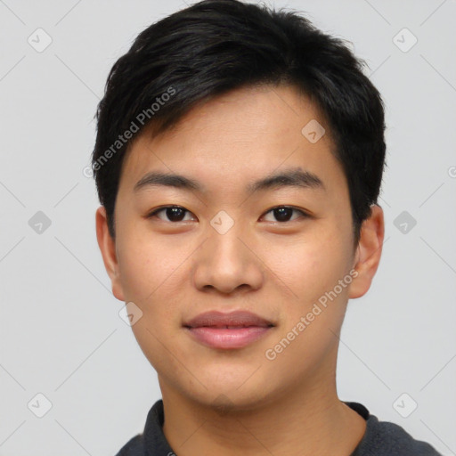 Joyful asian young-adult male with short  black hair and brown eyes