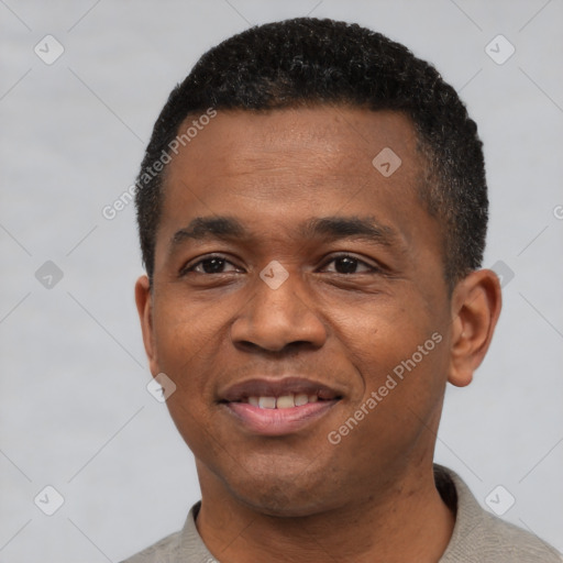 Joyful black young-adult male with short  black hair and brown eyes