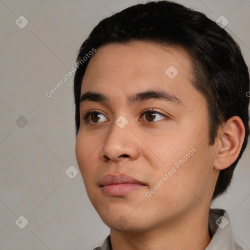 Neutral white young-adult male with short  black hair and brown eyes