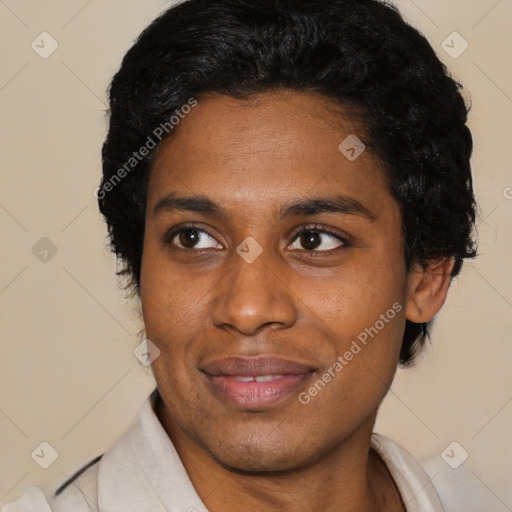 Joyful black young-adult male with short  black hair and brown eyes