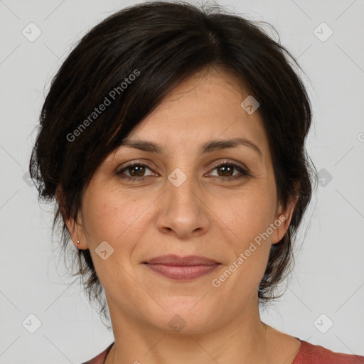 Joyful white adult female with medium  brown hair and brown eyes