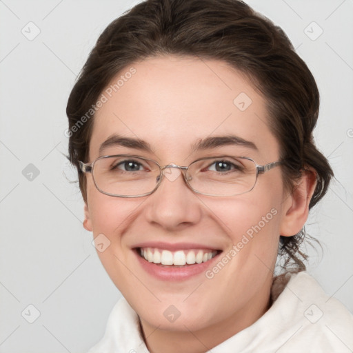 Joyful white young-adult female with medium  brown hair and grey eyes