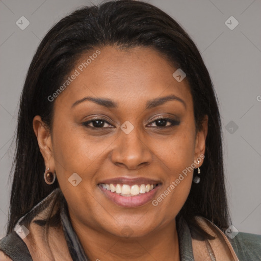 Joyful black young-adult female with long  brown hair and brown eyes