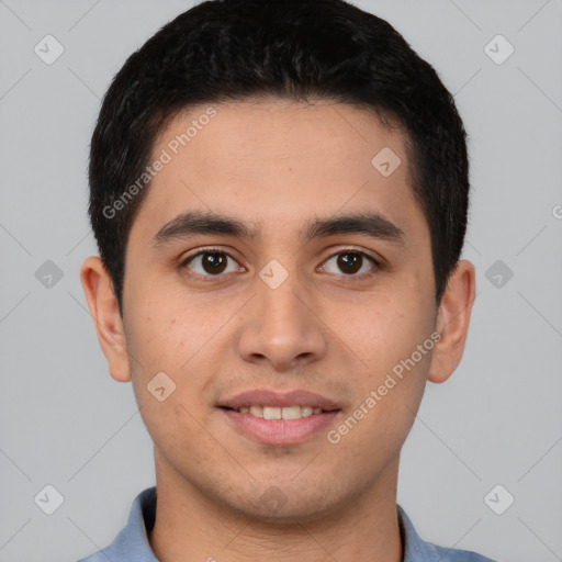 Joyful latino young-adult male with short  brown hair and brown eyes