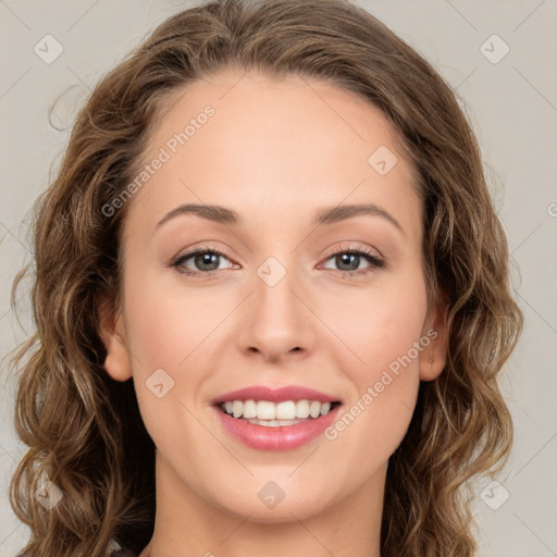 Joyful white young-adult female with long  brown hair and green eyes