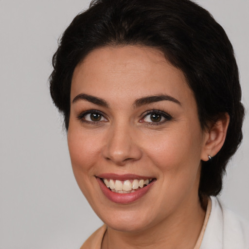 Joyful white young-adult female with medium  brown hair and brown eyes