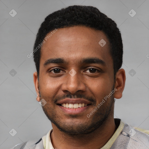 Joyful black young-adult male with short  black hair and brown eyes