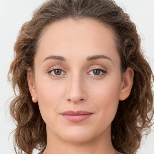 Joyful white young-adult female with long  brown hair and green eyes