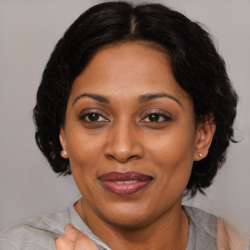 Joyful asian adult female with medium  brown hair and brown eyes
