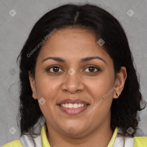 Joyful latino adult female with medium  brown hair and brown eyes