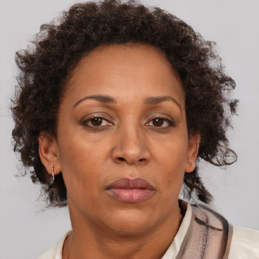 Neutral black adult female with short  brown hair and brown eyes