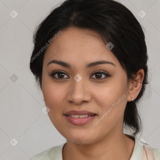 Joyful latino young-adult female with medium  brown hair and brown eyes