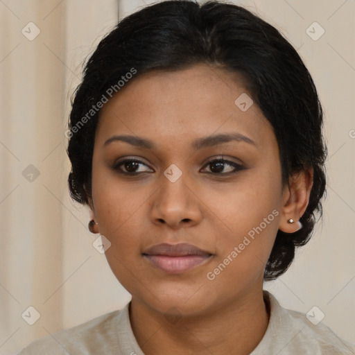 Joyful latino young-adult female with medium  brown hair and brown eyes