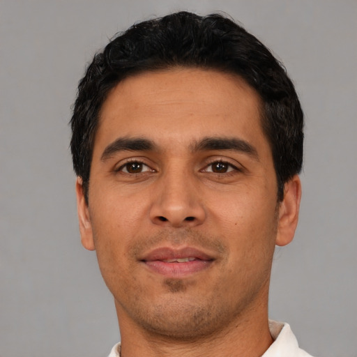 Neutral latino young-adult male with short  black hair and brown eyes
