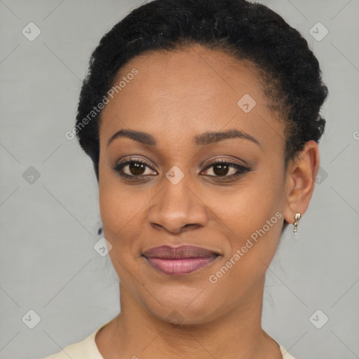 Joyful black young-adult female with short  brown hair and brown eyes