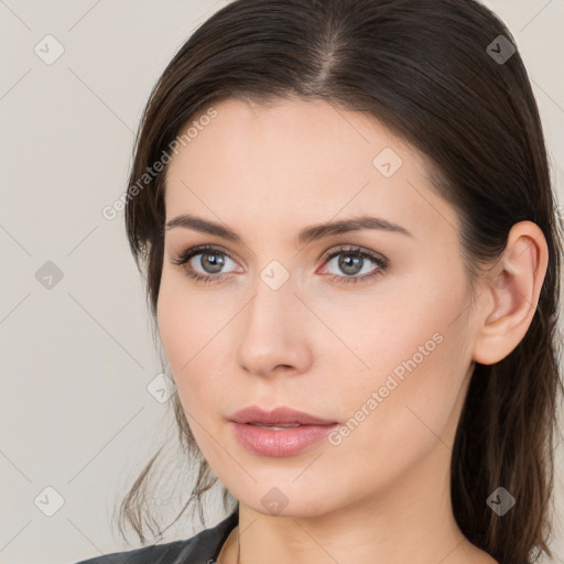 Neutral white young-adult female with long  brown hair and brown eyes