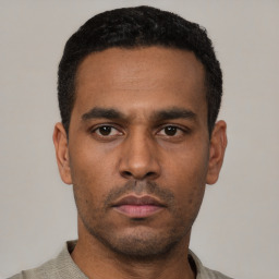 Neutral latino young-adult male with short  black hair and brown eyes