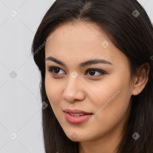 Joyful latino young-adult female with long  brown hair and brown eyes