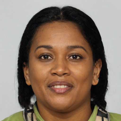 Joyful latino adult female with medium  black hair and brown eyes