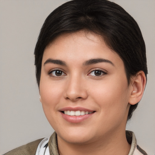 Joyful white young-adult female with short  brown hair and brown eyes