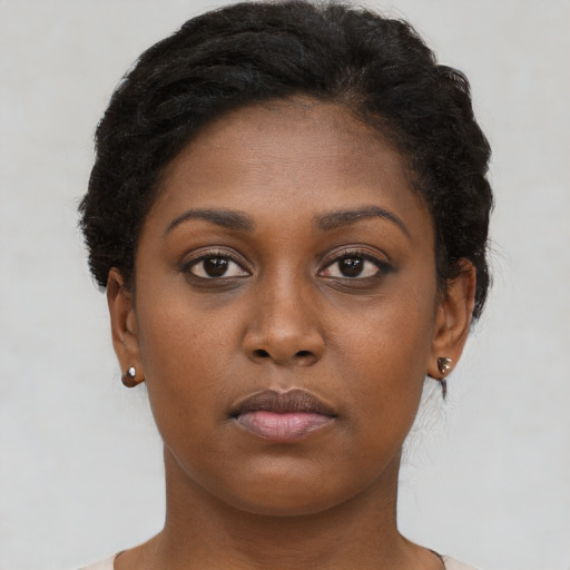 Neutral black young-adult female with short  brown hair and brown eyes
