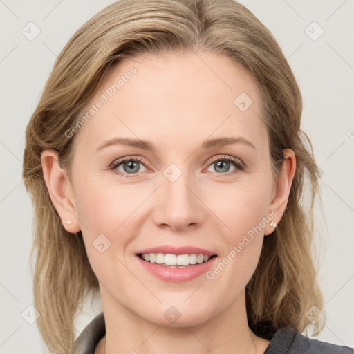 Joyful white young-adult female with medium  brown hair and blue eyes