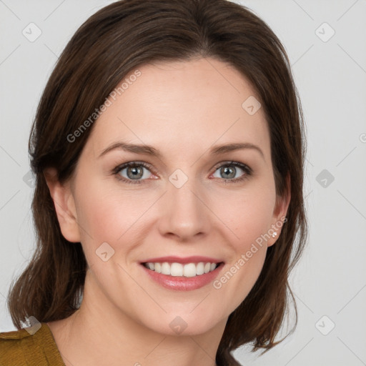 Joyful white young-adult female with medium  brown hair and blue eyes