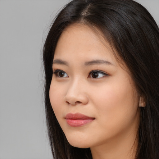 Neutral asian young-adult female with long  brown hair and brown eyes