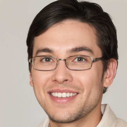 Joyful white young-adult male with short  brown hair and brown eyes